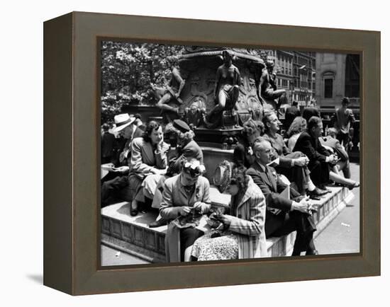 Woman Knitting Among Lunchtime Loungers Relaxing at Base of Statue at New York Public Library-Alfred Eisenstaedt-Framed Premier Image Canvas