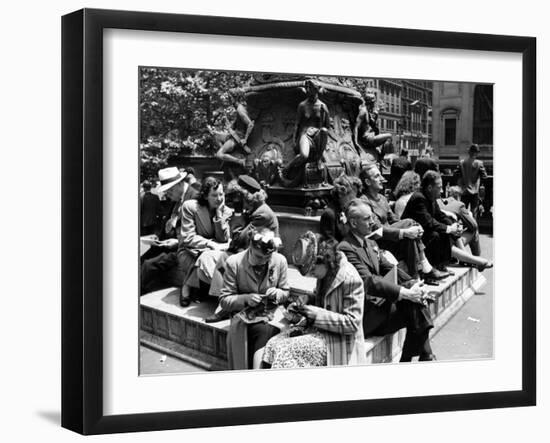 Woman Knitting Among Lunchtime Loungers Relaxing at Base of Statue at New York Public Library-Alfred Eisenstaedt-Framed Photographic Print