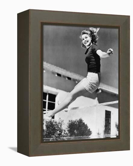 Woman Leaping over a Tennis Net-null-Framed Stretched Canvas