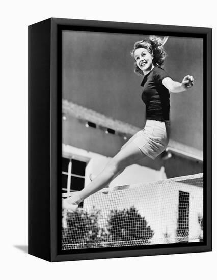 Woman Leaping over a Tennis Net-null-Framed Stretched Canvas