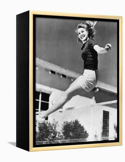 Woman Leaping over a Tennis Net-null-Framed Stretched Canvas