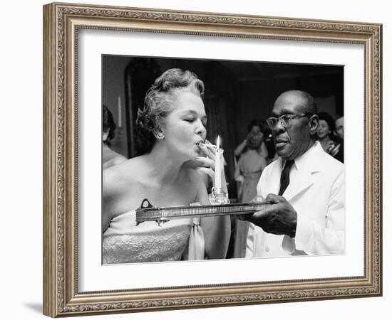 Woman Lighting a Cigarette from a Candle Held by a Waiter at the Piedmont Ball-Paul Schutzer-Framed Photographic Print