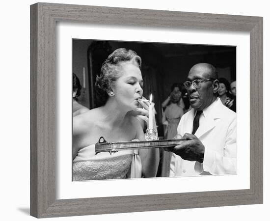 Woman Lighting a Cigarette from a Candle Held by a Waiter at the Piedmont Ball-Paul Schutzer-Framed Photographic Print