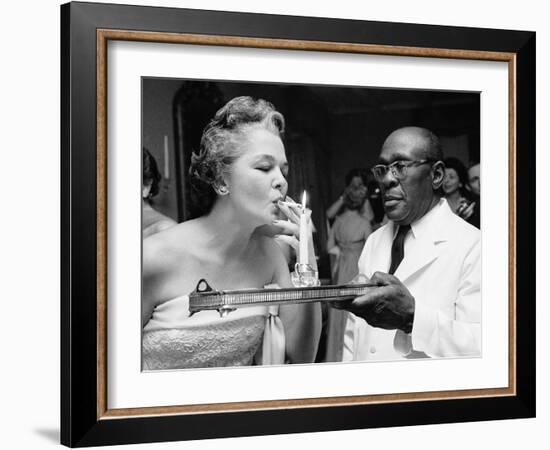 Woman Lighting a Cigarette from a Candle Held by a Waiter at the Piedmont Ball-Paul Schutzer-Framed Photographic Print