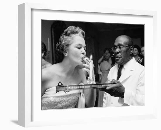 Woman Lighting a Cigarette from a Candle Held by a Waiter at the Piedmont Ball-Paul Schutzer-Framed Photographic Print