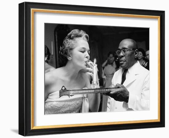 Woman Lighting a Cigarette from a Candle Held by a Waiter at the Piedmont Ball-Paul Schutzer-Framed Photographic Print