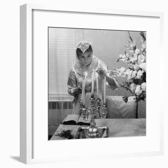 Woman Lighting Candles During Hasidic Jewish Wedding Ceremony-Yale Joel-Framed Photographic Print