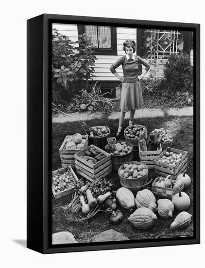 Woman Looking at Victory Garden Harvest Sitting on Lawn, Waiting to Be Stored Away for Winter-Walter Sanders-Framed Premier Image Canvas