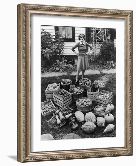 Woman Looking at Victory Garden Harvest Sitting on Lawn, Waiting to Be Stored Away for Winter-Walter Sanders-Framed Photographic Print