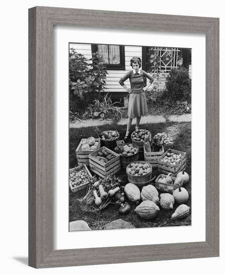 Woman Looking at Victory Garden Harvest Sitting on Lawn, Waiting to Be Stored Away for Winter-Walter Sanders-Framed Photographic Print