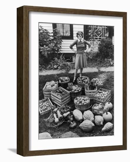 Woman Looking at Victory Garden Harvest Sitting on Lawn, Waiting to Be Stored Away for Winter-Walter Sanders-Framed Photographic Print