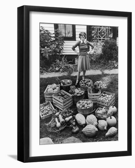 Woman Looking at Victory Garden Harvest Sitting on Lawn, Waiting to Be Stored Away for Winter-Walter Sanders-Framed Photographic Print