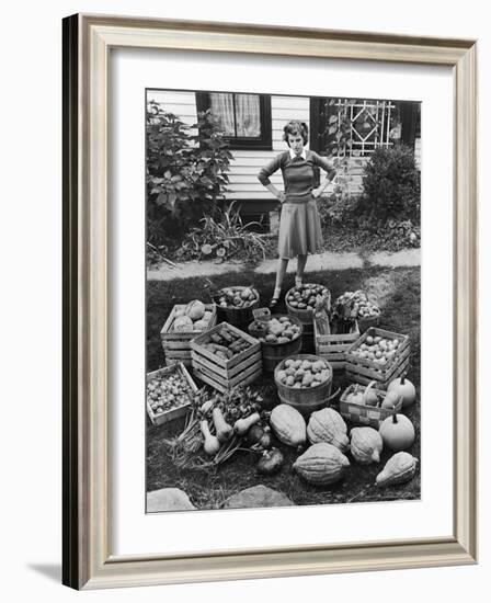 Woman Looking at Victory Garden Harvest Sitting on Lawn, Waiting to Be Stored Away for Winter-Walter Sanders-Framed Photographic Print