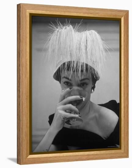 Woman Modeling White Satin Hat, with White Glycerin Feathers to Flatter Low Draped Neckline-Nina Leen-Framed Premier Image Canvas