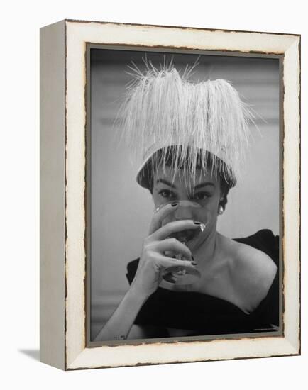 Woman Modeling White Satin Hat, with White Glycerin Feathers to Flatter Low Draped Neckline-Nina Leen-Framed Premier Image Canvas