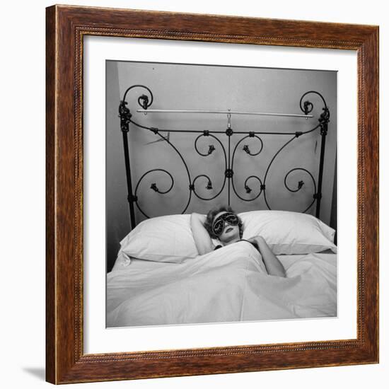 Woman Models Satin Edged Sleep Mask Displaying Lining of Gold Braid, Eyelashes and Twinkling Starts-Yale Joel-Framed Photographic Print