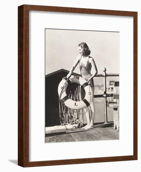 Woman on Pier Holding a Life Preserver-Everett Collection-Framed Photographic Print