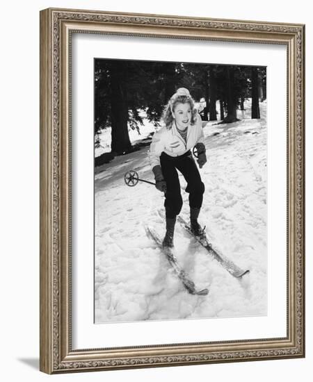 Woman on Skiis with Knees Bent-null-Framed Photo