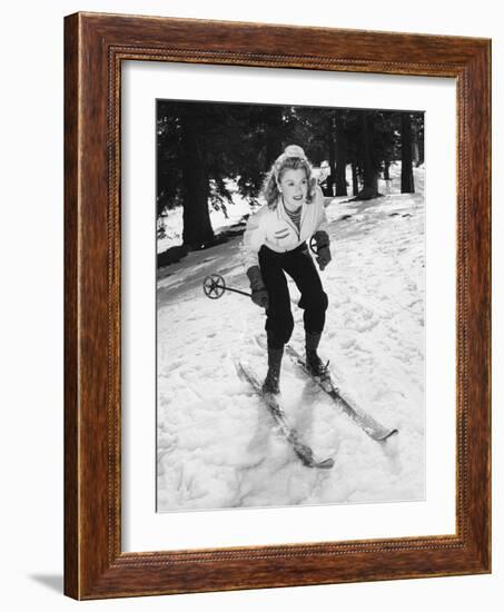 Woman on Skiis with Knees Bent-null-Framed Photo