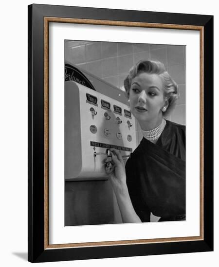 Woman Operating Coin-Operated Perfume Vending Machine-Nina Leen-Framed Photographic Print