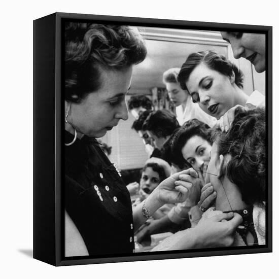 Woman Piercing Another Woman's Ears as Friends Look On-Robert W^ Kelley-Framed Premier Image Canvas