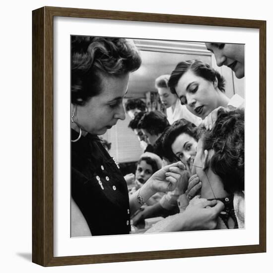 Woman Piercing Another Woman's Ears as Friends Look On-Robert W^ Kelley-Framed Photographic Print