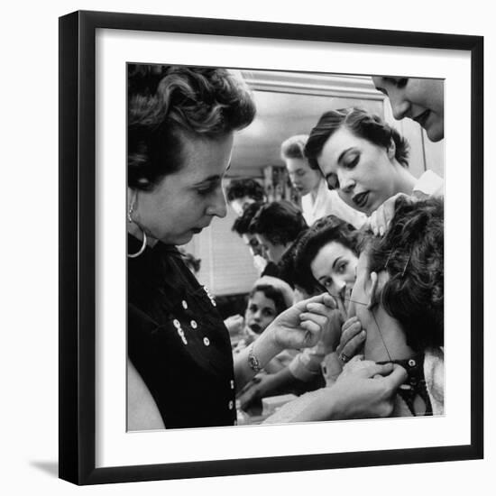 Woman Piercing Another Woman's Ears as Friends Look On-Robert W^ Kelley-Framed Photographic Print