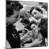 Woman Piercing Another Woman's Ears as Friends Look On-Robert W^ Kelley-Mounted Photographic Print