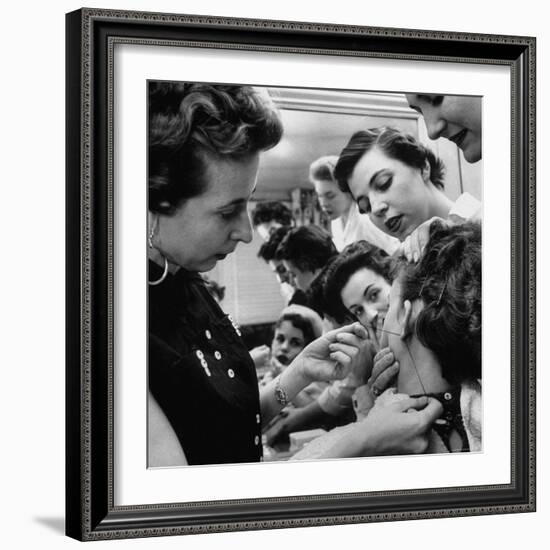 Woman Piercing Another Woman's Ears as Friends Look On-Robert W^ Kelley-Framed Photographic Print