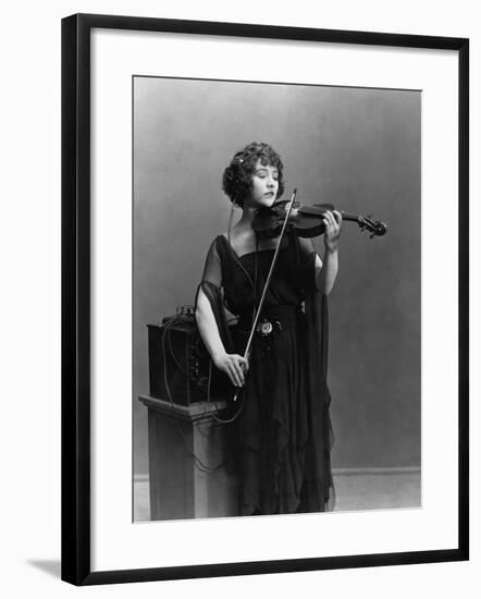 Woman Playing Violin with Headphones-null-Framed Photo