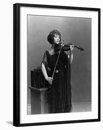 Woman Playing Violin with Headphones-null-Framed Photo