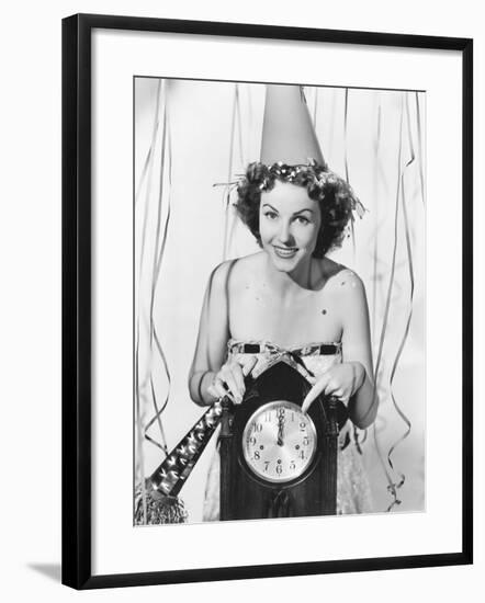 Woman Pointing at the Clock at Midnight-null-Framed Photo