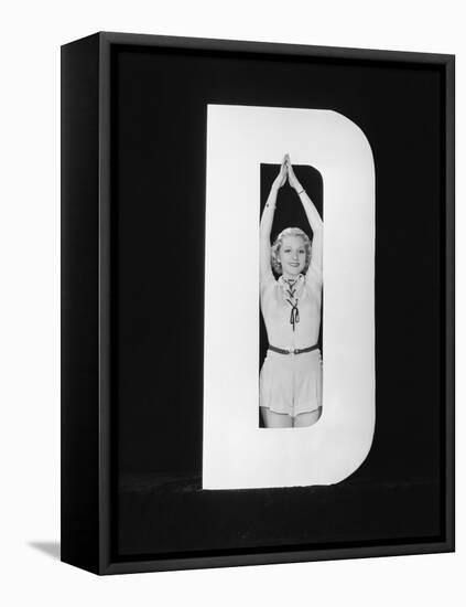 Woman Posing in Middle of Letter D-Everett Collection-Framed Premier Image Canvas