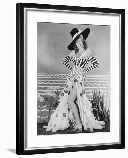 Woman Posing in Striped and Polkadot Costume-null-Framed Photo