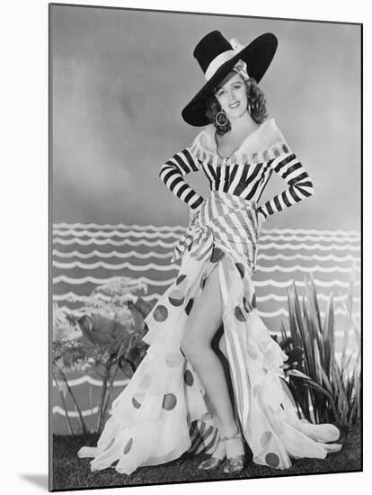Woman Posing in Striped and Polkadot Costume-null-Mounted Photo