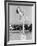 Woman Posing on Top of a Pillar Next to a Swimming Pool-null-Framed Photo