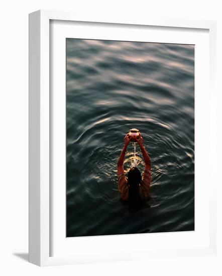 Woman Pouring Water During Morning Puja on Ganges, Varanasi, India-Anthony Plummer-Framed Photographic Print