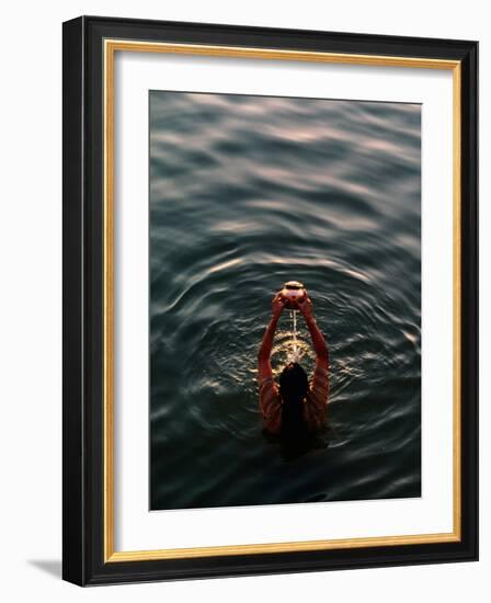 Woman Pouring Water During Morning Puja on Ganges, Varanasi, India-Anthony Plummer-Framed Photographic Print