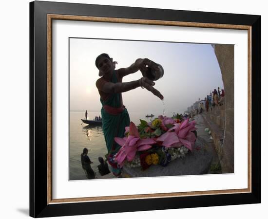 Woman Pouring Water Over Flowers on an Altar as a Religious Ritual, Varanasi, India-Eitan Simanor-Framed Photographic Print