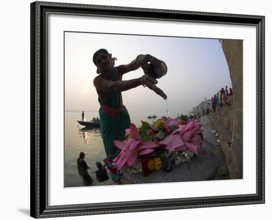 Woman Pouring Water Over Flowers on an Altar as a Religious Ritual, Varanasi, India-Eitan Simanor-Framed Photographic Print