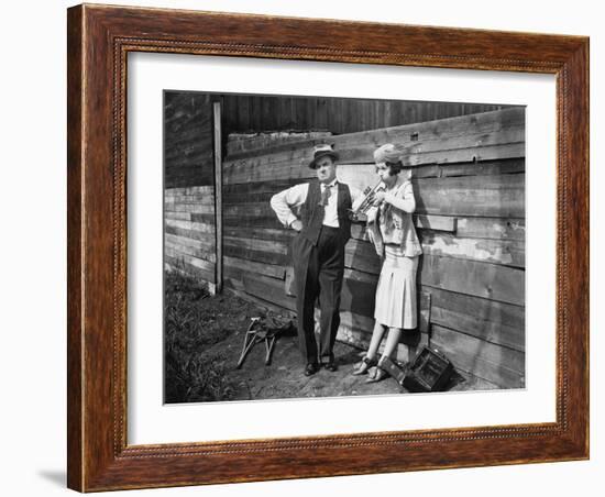 Woman Practicing Her Trumpet While a Man is Standing Next to Her Looking Annoyed-null-Framed Photo