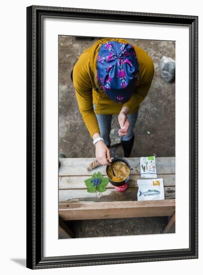 Woman Prepares Her Dinner At Her Camp Site In The Backcountry-Hannah Dewey-Framed Photographic Print