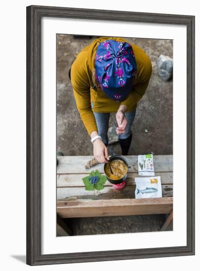 Woman Prepares Her Dinner At Her Camp Site In The Backcountry-Hannah Dewey-Framed Photographic Print