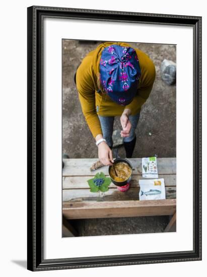 Woman Prepares Her Dinner At Her Camp Site In The Backcountry-Hannah Dewey-Framed Photographic Print