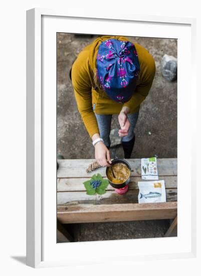 Woman Prepares Her Dinner At Her Camp Site In The Backcountry-Hannah Dewey-Framed Photographic Print