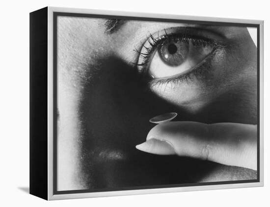 Woman Preparing to Insert Contact Lens Into Her Eye-Henry Groskinsky-Framed Premier Image Canvas