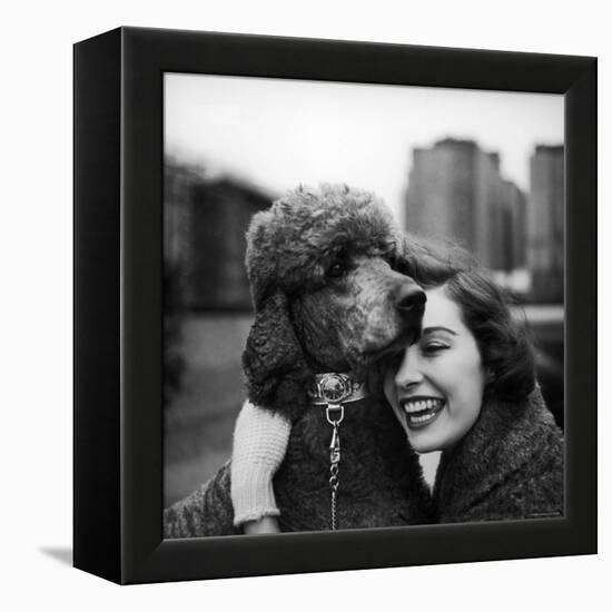 Woman Profiling a Big Smile While Adoring Her Poodle Wearing Large Swiss Watch on Dog Collar-Yale Joel-Framed Premier Image Canvas