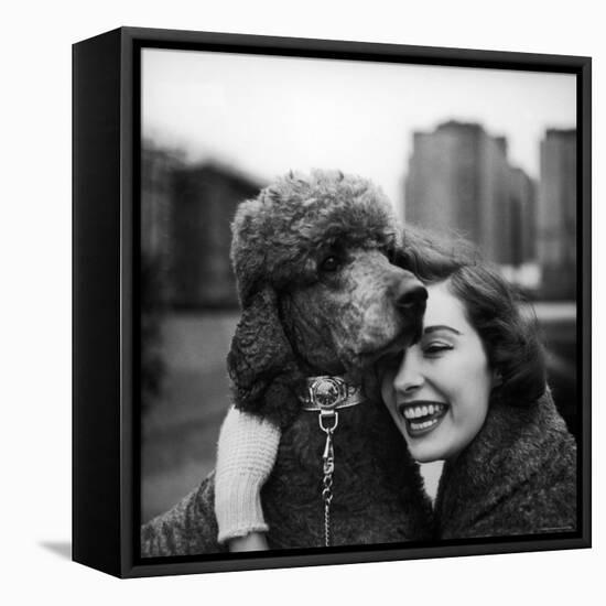 Woman Profiling a Big Smile While Adoring Her Poodle Wearing Large Swiss Watch on Dog Collar-Yale Joel-Framed Premier Image Canvas