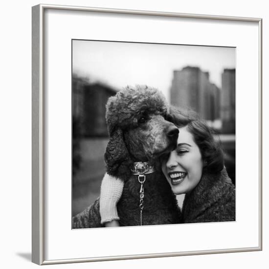 Woman Profiling a Big Smile While Adoring Her Poodle Wearing Large Swiss Watch on Dog Collar-Yale Joel-Framed Photographic Print