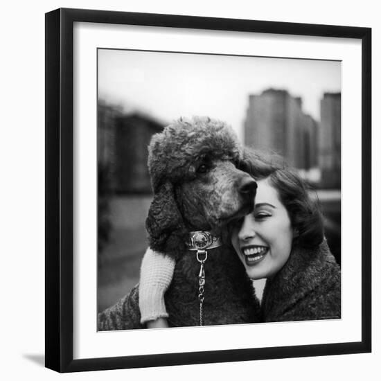 Woman Profiling a Big Smile While Adoring Her Poodle Wearing Large Swiss Watch on Dog Collar-Yale Joel-Framed Photographic Print